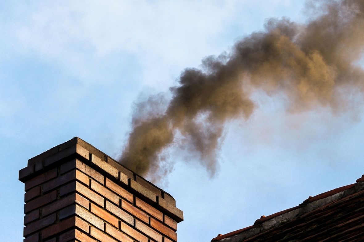 a chimney blowing out black smoke